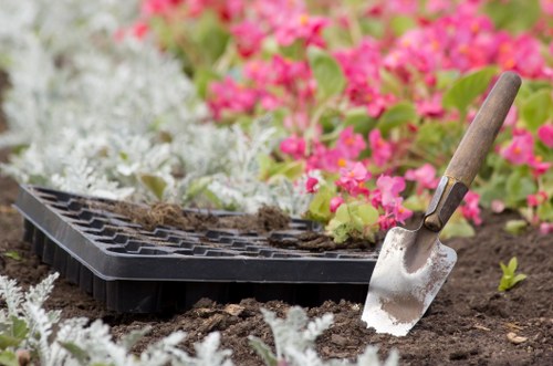 Gardeners applying compost and mulch to beds